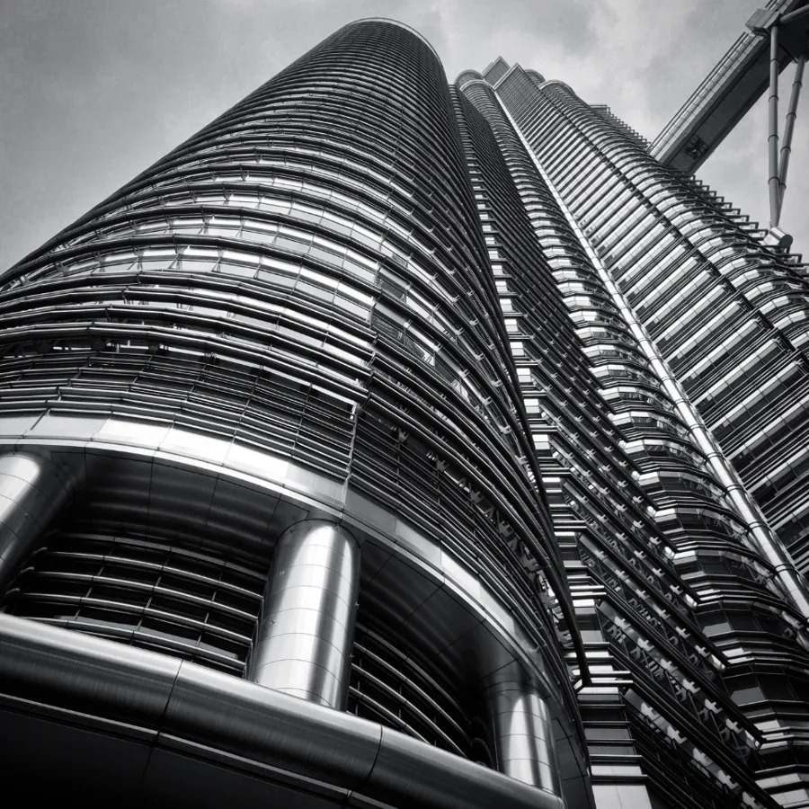 The curved glass facade of an office tower